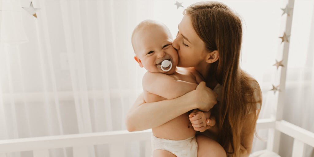 The age of your first child predicts your long-term educational and financial success