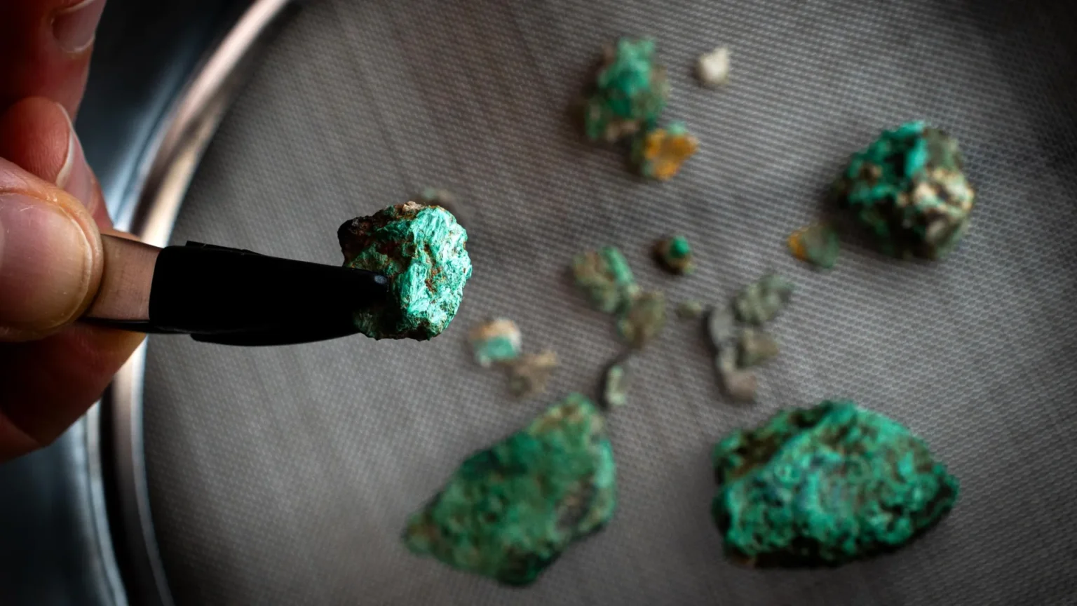 A child’s tooth and a strange green stone reveal a 5,500-year-old mystery